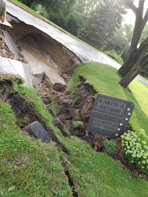 Sinkhole damages marker at Karen A. Nelson Memorial Dog Park at Quarry Lake Park